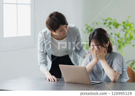 A crying businesswoman and a troubled senior 120995129