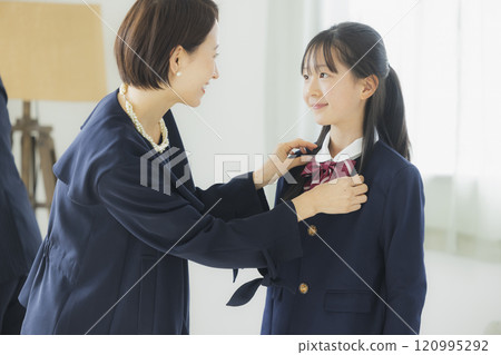 High school girl and her family looking in the mirror High school girl and her family looking in the mirror 120995292