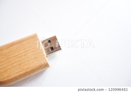 flash disk with a cover made of wood on a white background. 120996481