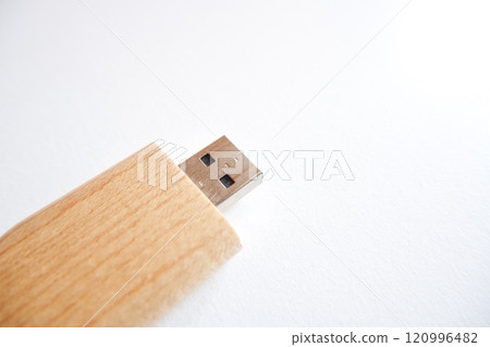 flash disk with a cover made of wood on a white background. 120996482