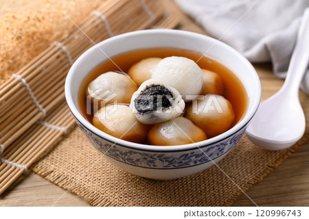 Tangyuan (Chinese sweet dumpling), Glutinous rice flour filling with black sesame in ginger syrup Tangyuan (Chinese sweet dumpling), Glutinous rice flour filling with black sesame in ginger syrup 120996743