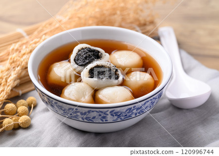 Tangyuan (Chinese sweet dumpling), Glutinous rice flour filling with black sesame in ginger syrup Tangyuan (Chinese sweet dumpling), Glutinous rice flour filling with black sesame in ginger syrup 120996744