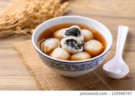 Tangyuan (Chinese sweet dumpling), Glutinous rice flour filling with black sesame in ginger syrup 120996747