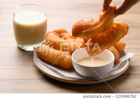 Asian deep fried dough eaten with soy milk and condensed milk, Thai style breakfast Asian deep fried dough eaten with soy milk and condensed milk, Thai style breakfast 120996762