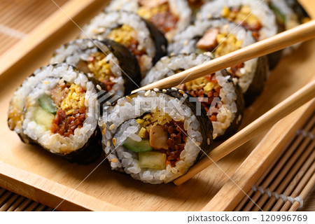 Korean Gimbap or kimbap made from cooked rice with vegetables, meat and wrapped with dried seaweed Korean Gimbap or kimbap made from cooked rice with vegetables, meat and wrapped with dried seaweed 120996769