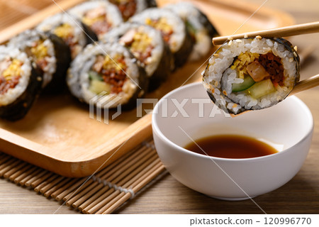 Korean Gimbap or kimbap made from cooked rice with vegetables, meat and wrapped with dried seaweed Korean Gimbap or kimbap made from cooked rice with vegetables, meat and wrapped with dried seaweed 120996770