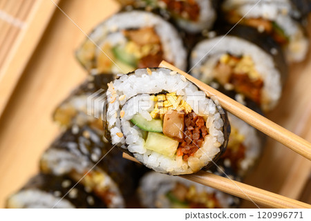 Korean Gimbap or kimbap made from cooked rice with vegetables, meat and wrapped with dried seaweed 120996771