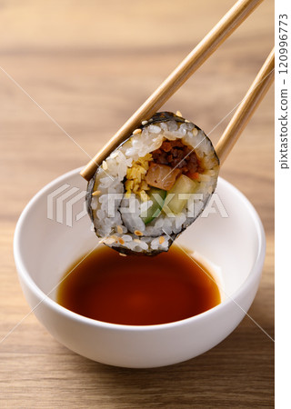 Korean Gimbap or kimbap made from cooked rice with vegetables, meat and wrapped with dried seaweed 120996773