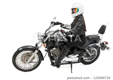 Biker girl riding a bike 120998710