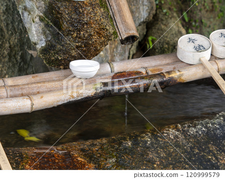 Chozuya of a shrine where water flows Chozuya of a shrine where water flows 120999579