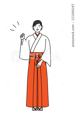 穿著白大褂、穿著猩紅色袴的巫女在握拳 121000267