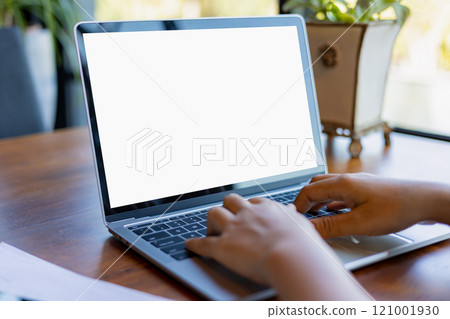 Human hand use laptop and looking at it, Blank screen tablet with white background for advertising text, Woman using laptop contact business search information, Marketing and creative design. Human hand use laptop and looking at it, Blank screen tablet with white background for advertising text, Woman using laptop contact business search information, Marketing and creative design. 121001930