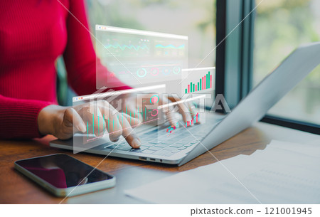 Professional women wearing red sweater working about new startup on laptop to analysis finance of project in outside office, Woman working using laptop online meeting in home office. 121001945