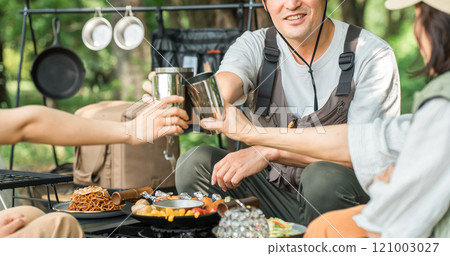 Families enjoying camping and glamping at a campsite Families enjoying camping and glamping at a campsite 121003027