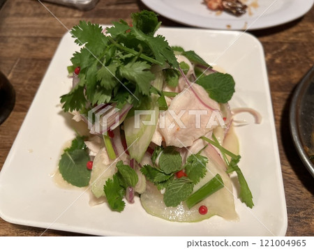 Thai-style salad with pear, celery and steamed chicken Thai-style salad with pear, celery and steamed chicken 121004965