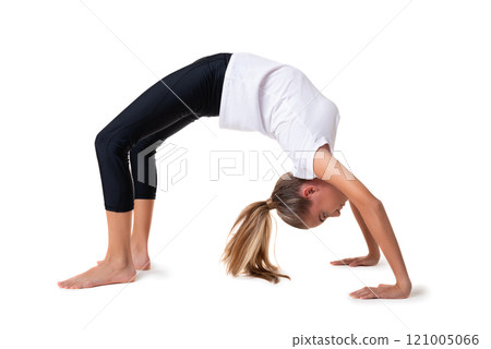 Young attractive woman practicing yoga on floor, standing in bridge exercise, Urdhva Dhanurasana pose, working out, wearing sportswear. Full length, isolated on white 121005066