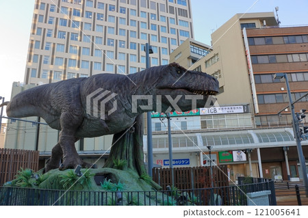 Animatronic robot dinosaur statues at Fukui train and bus stations in Fukui City in Japan 121005641