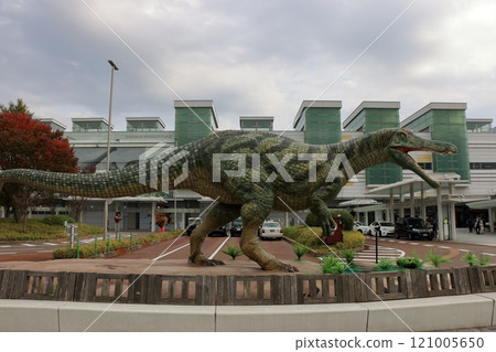 Animatronic robot dinosaur statues at Fukui train and bus stations in Fukui City in Japan 121005650