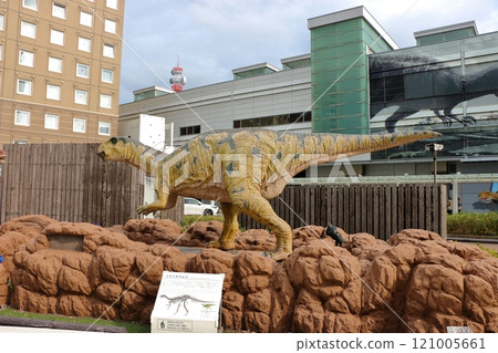 Animatronic robot dinosaur statues at Fukui train and bus stations in Fukui City in Japan 121005661