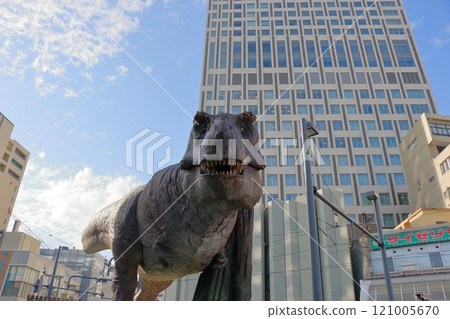Animatronic robot dinosaur statues at Fukui train and bus stations in Fukui City in Japan 121005670