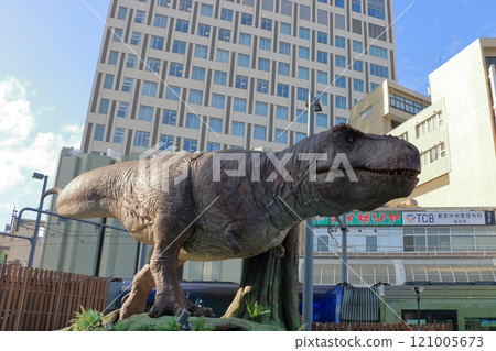 Animatronic robot dinosaur statues at Fukui train and bus stations in Fukui City in Japan 121005673