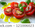 Freshly sliced tomatoes drizzled with olive oil and garnished with basil, creating vibrant and appetizing dish. Perfect for salads or as side 121006023