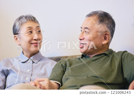 Senior couple cuddling with a smile 121006243