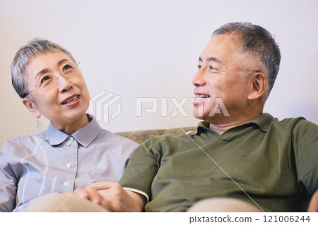 Senior couple cuddling with a smile 121006244