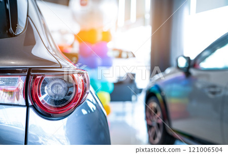 Car parked in luxury showroom. Car dealership office. Car showroom business. New car parked in modern showroom. Auto for sale and rent business. Automobile leasing and insurance. Electric automobile. 121006504