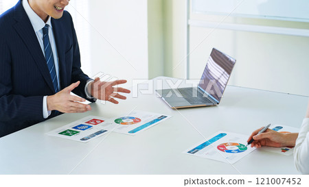 Group of business people discussing business in an office 121007452