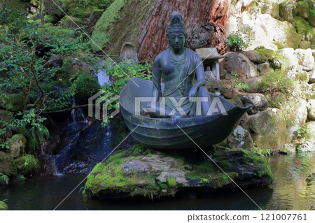 Statue of Avalokitesvara on a boat made from a leaf from the vision of Zen Master Dogen Zenji near the entrance to Daihonzan Eiheiji Temple near Fukui Japan 121007761