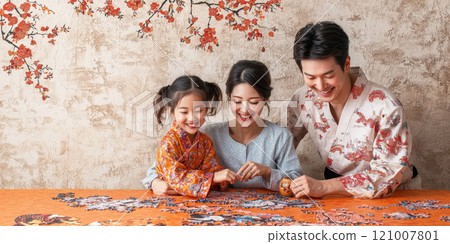 family joyfully assembling traditional Chinese New Year puzzle together family joyfully assembling traditional Chinese New Year puzzle together 121007801