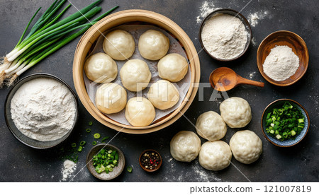 Fresh dumpling ingredients including flour, scallions, and dumplings Fresh dumpling ingredients including flour, scallions, and dumplings 121007819