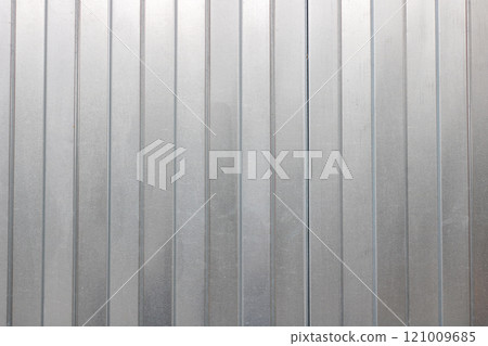 This is a closeup view of a metal wall that showcases a striped pattern 121009685
