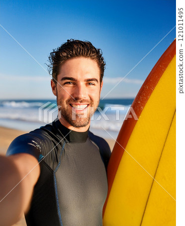 Excited Man Taking a Surfing Selfie on a Sunny Beach 121011495