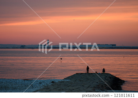 Sunset view of Kansai International Airport in Osaka, Japan built on an artificial island in the middle of the Osaka Bay 121011611