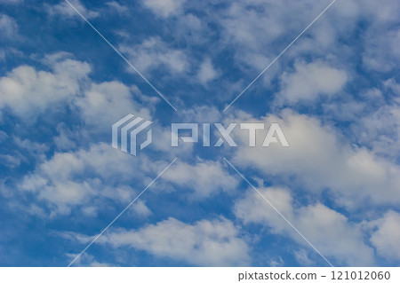 Ornamental clouds. Dramatic sky. Epic storm cloudscape Soft sunlight. Panoramic image texture background graphic resources design Meteorology, heaven hope peace concept 121012060