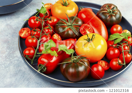 Tomatoes of different varieties in a plate 121012316