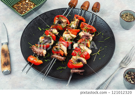 A plate of octopus skewers. 121012320