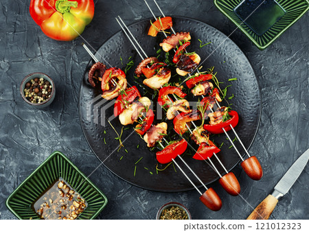 Octopus skewers grilled. 121012323