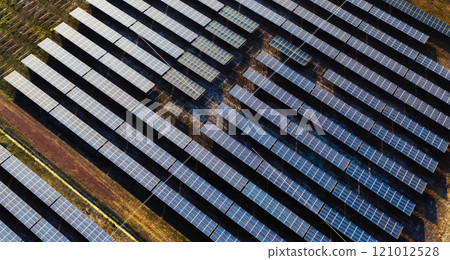 large field of solar panels is shown from above 121012528