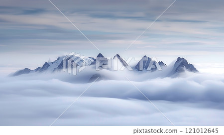 A mystical, fog-covered mountain range with peaks emerging like islands captivates with serene, ethereal beauty. 121012645