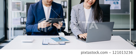 Kind leader executive manager share and discuss business solutions plan ideas on tablet with Asian female marketing manager 121013236