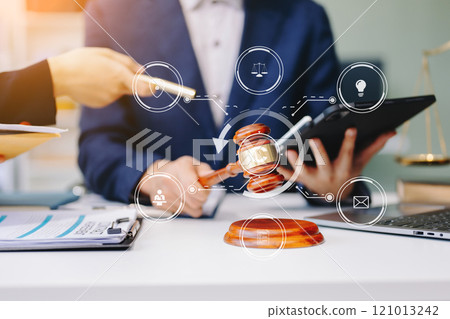Copyright or patent concept, Business team analyzing data and using smart phone and tablet with virtual screen copyright icon trademark license, Creation ownership against piracy. 121013242