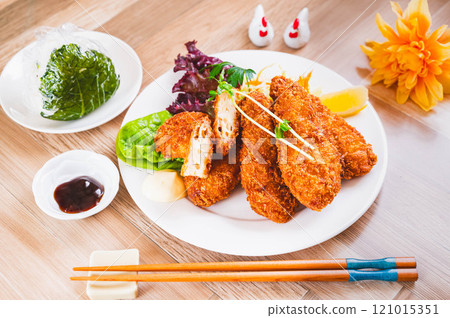 Chicken fillet and cheese cutlet with green vegetables onigiri Chicken fillet and cheese cutlet with green vegetables onigiri 121015351