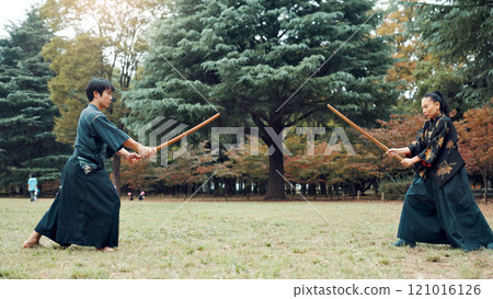Wooden sword, Japanese people and outdoor as martial arts for training, exercise and sports. Culture, weapon and heritage for fight, combat and practice as self defense technique for bojutsu in Japan Wooden sword, Japanese people and outdoor as martial arts for training, exercise and sports. Culture, weapon and heritage for fight, combat and practice as self defense technique for bojutsu in Japan 121016126