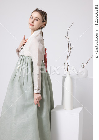 A foreign woman wearing traditional Korean hanbok A foreign woman wearing traditional Korean hanbok 121016291