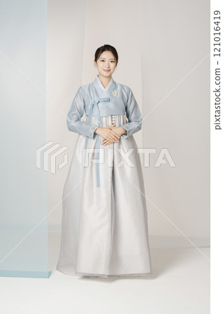A beautiful woman standing wearing an elegant and elegant hanbok A beautiful woman standing wearing an elegant and elegant hanbok 121016419