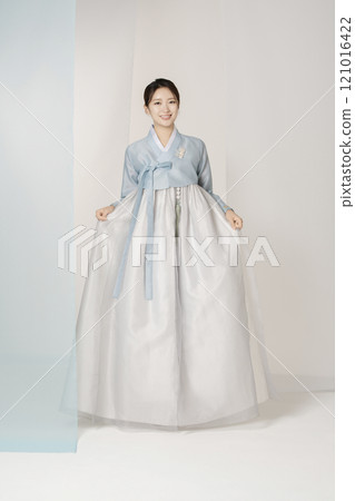 A beautiful woman standing wearing an elegant and elegant hanbok A beautiful woman standing wearing an elegant and elegant hanbok 121016422