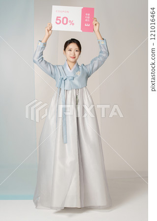 Portrait of a beautiful woman standing holding a shopping coupon while wearing an elegant and elegant hanbok Portrait of a beautiful woman standing holding a shopping coupon while wearing an elegant and elegant hanbok 121016464